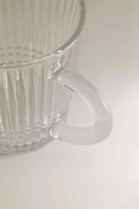 GLASS MUG WITH A RAISED GEOMETRIC DESIGN