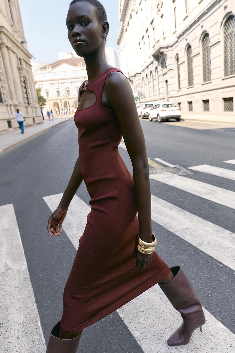 CUT OUT KNIT DRESS WITH METAL DETAIL