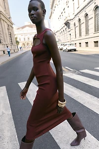 CUT OUT KNIT DRESS WITH METAL DETAIL