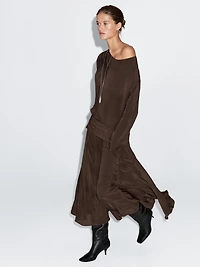 Long flowing dress with draped sash belt