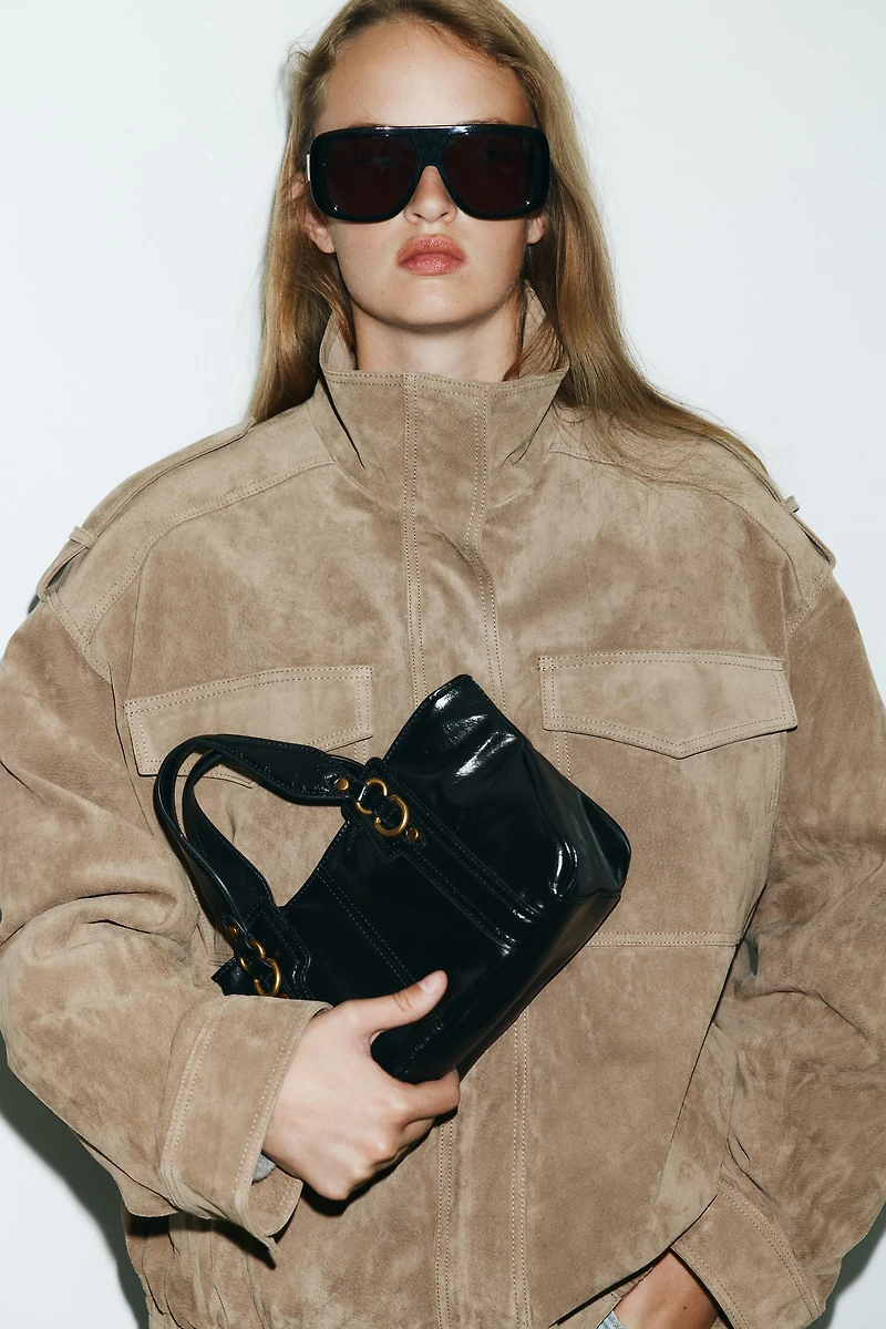 HANDBAG WITH METALLIC DETAILS