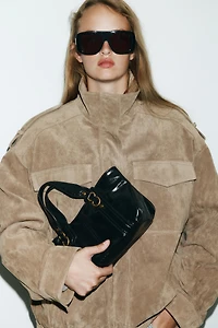 HANDBAG WITH METALLIC DETAILS