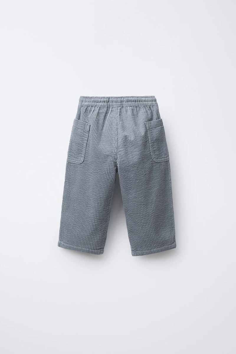 PANTALON EN VELOURS CÔTELÉ À POCHES