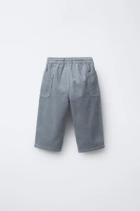 PANTALON EN VELOURS CÔTELÉ À POCHES