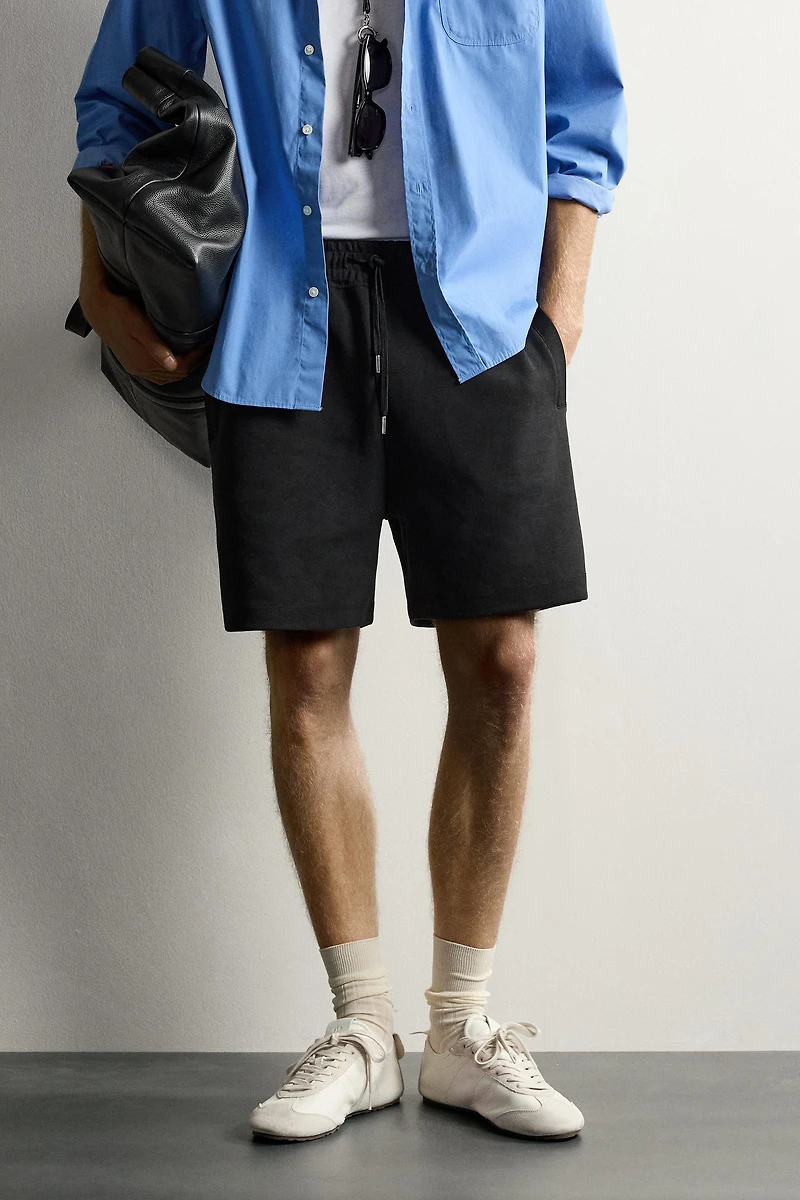 RELAXED FIT INTERLOCK TRACK SHORTS
