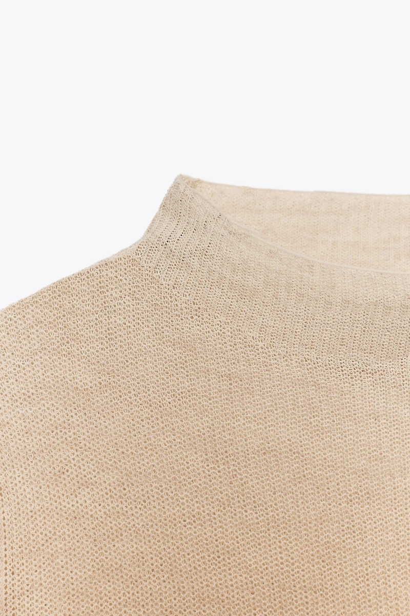 PULL EN MAILLE À COL CHEMINÉE
