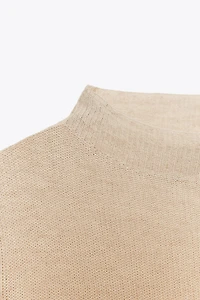 PULL EN MAILLE À COL CHEMINÉE
