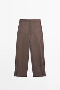 Total look flowing trousers with buttoned hems