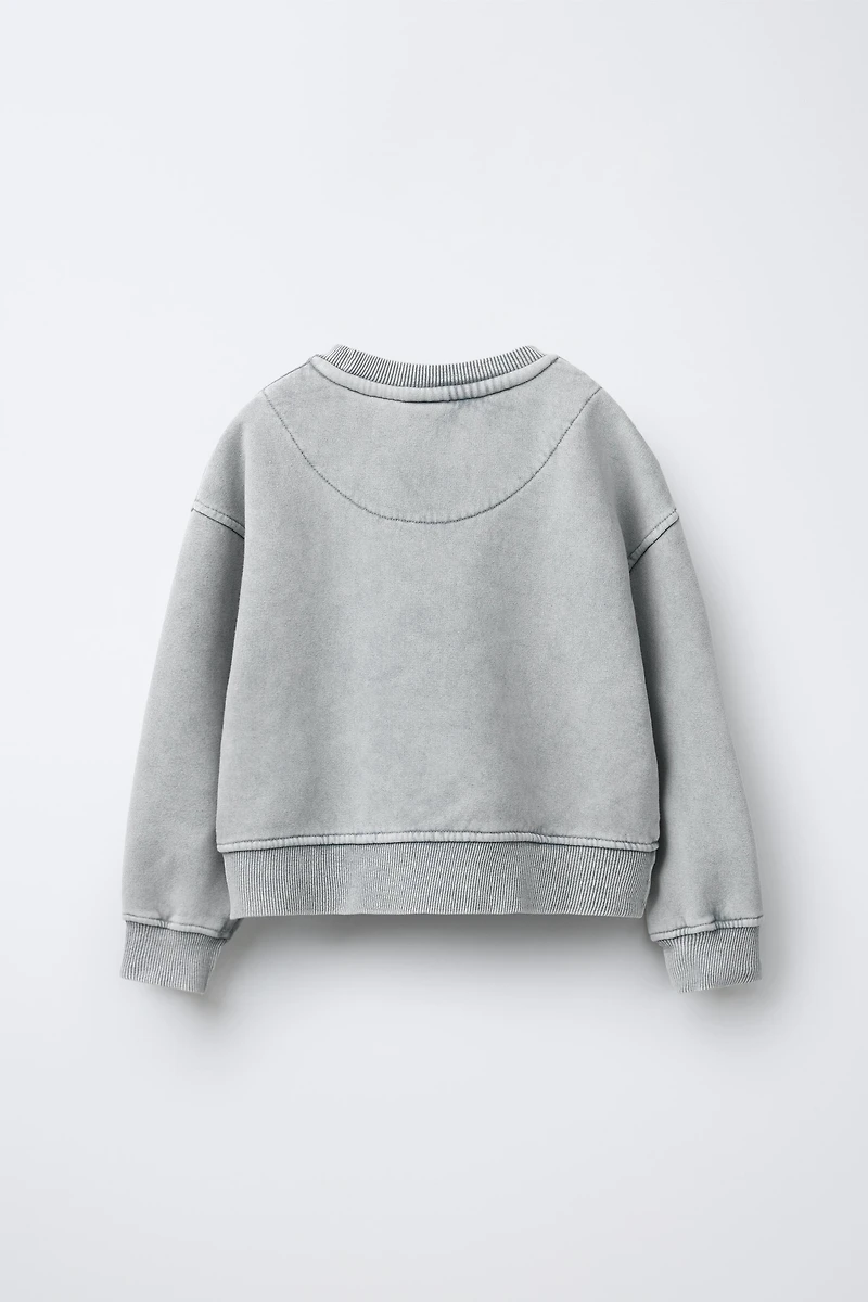 SWEAT EFFET DÉLAVÉ ÉTOILE BRILLANT