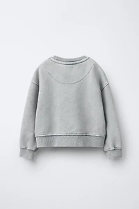 SWEAT EFFET DÉLAVÉ ÉTOILE BRILLANT