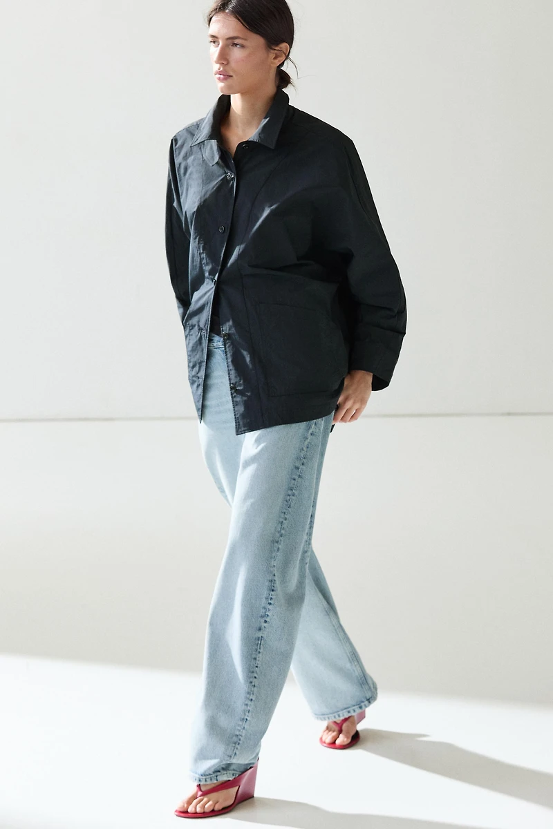Jacket with buttoned collar strap