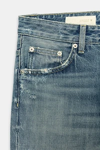 TRF FLARE RIPPED MID-RISE JEANS