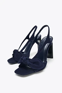 SUEDE BOW HEELED SANDALS
