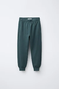 ENSEMBLE INTERLOCK SWEAT ET JOGGER INSCRIPTION EN RELIEF