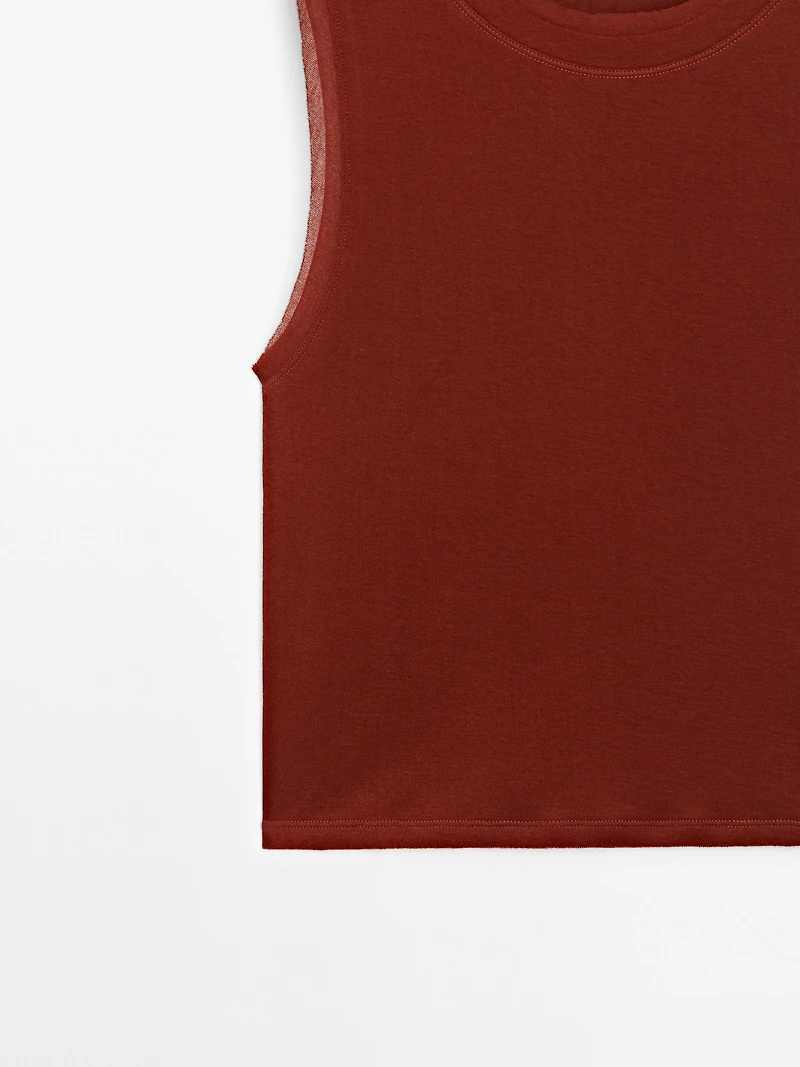 Sleeveless T-shirt with double piping