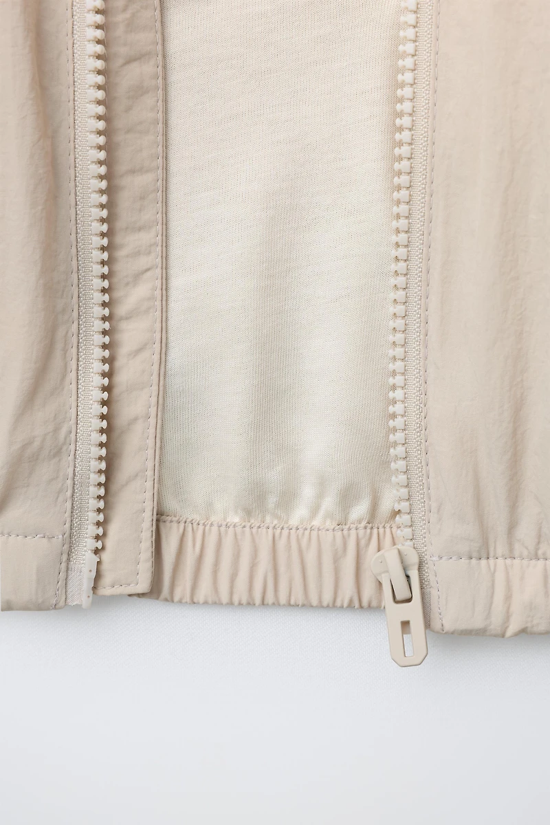 LIGHTWEIGHT COLORBLOCK WATER REPELLENT RAINCOAT
