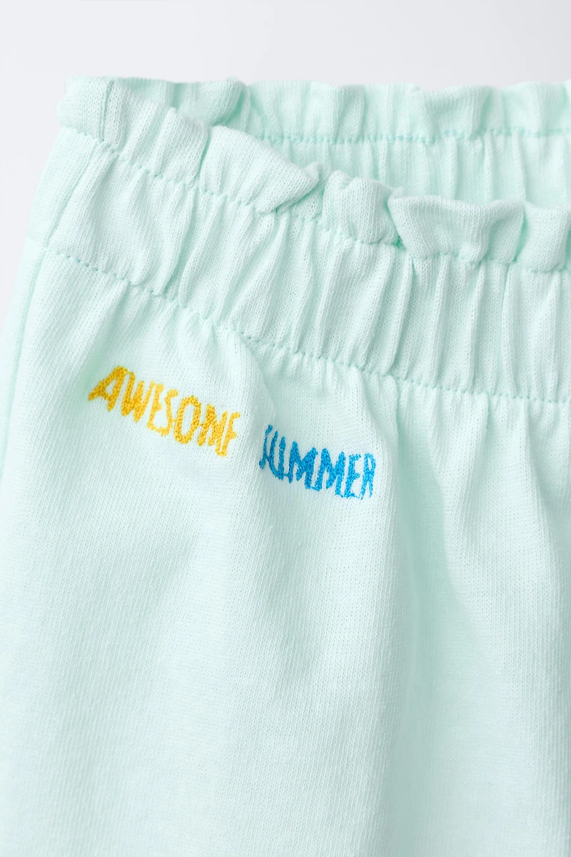 SHORT À VOLANTS IMPRIMÉ TROPICAL
