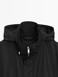Hooded parka with fabric detail
