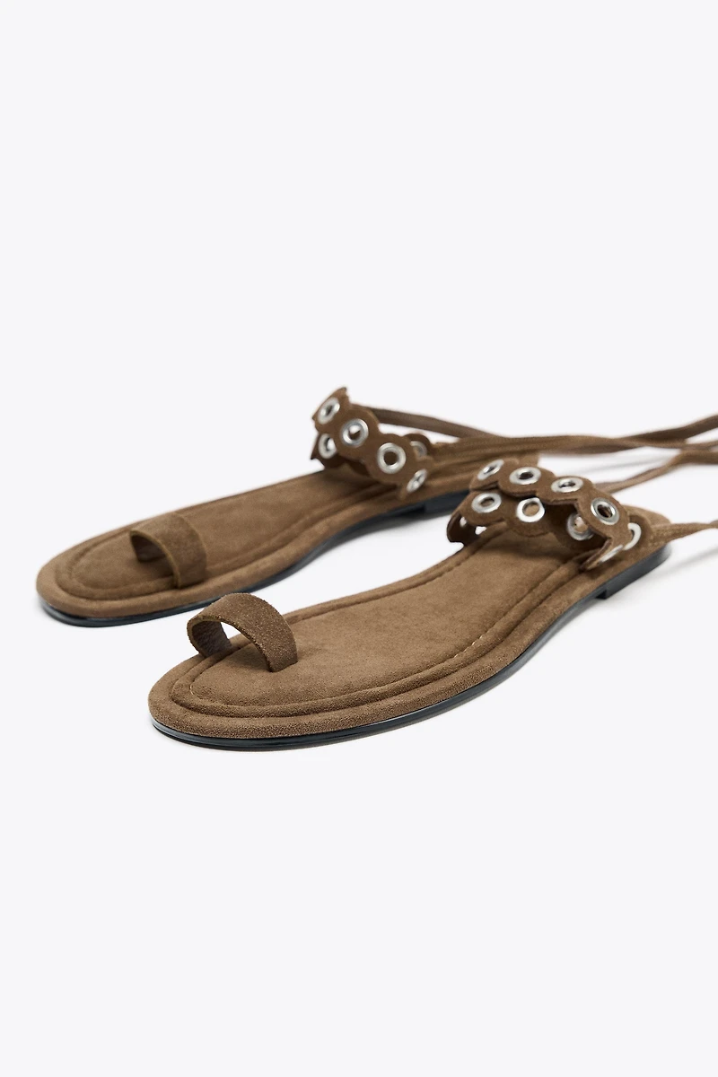 LEATHER SANDALS WITH METAL EYELETS