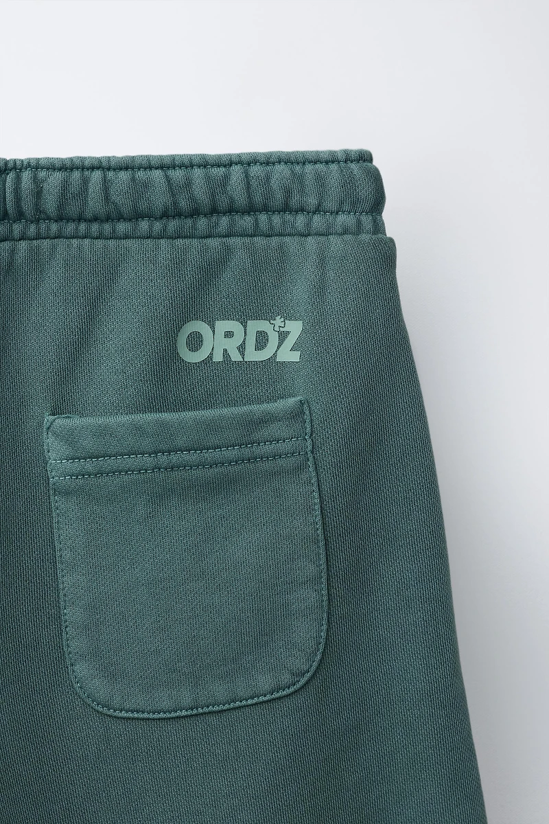 GARMENT DYED LOGO PLUSH SHORTS