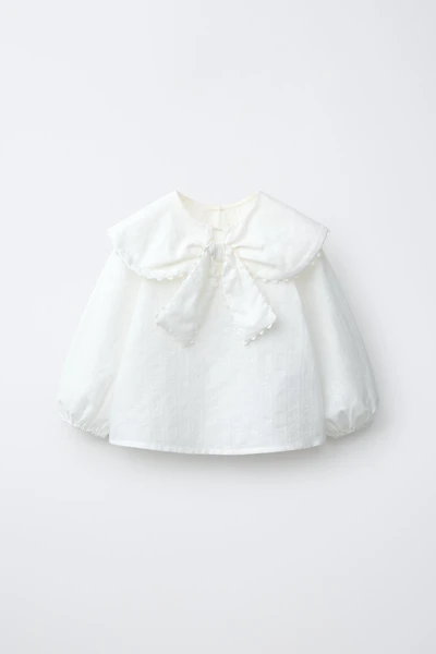 CHEMISE EN PLUMETIS À COL CLAUDINE