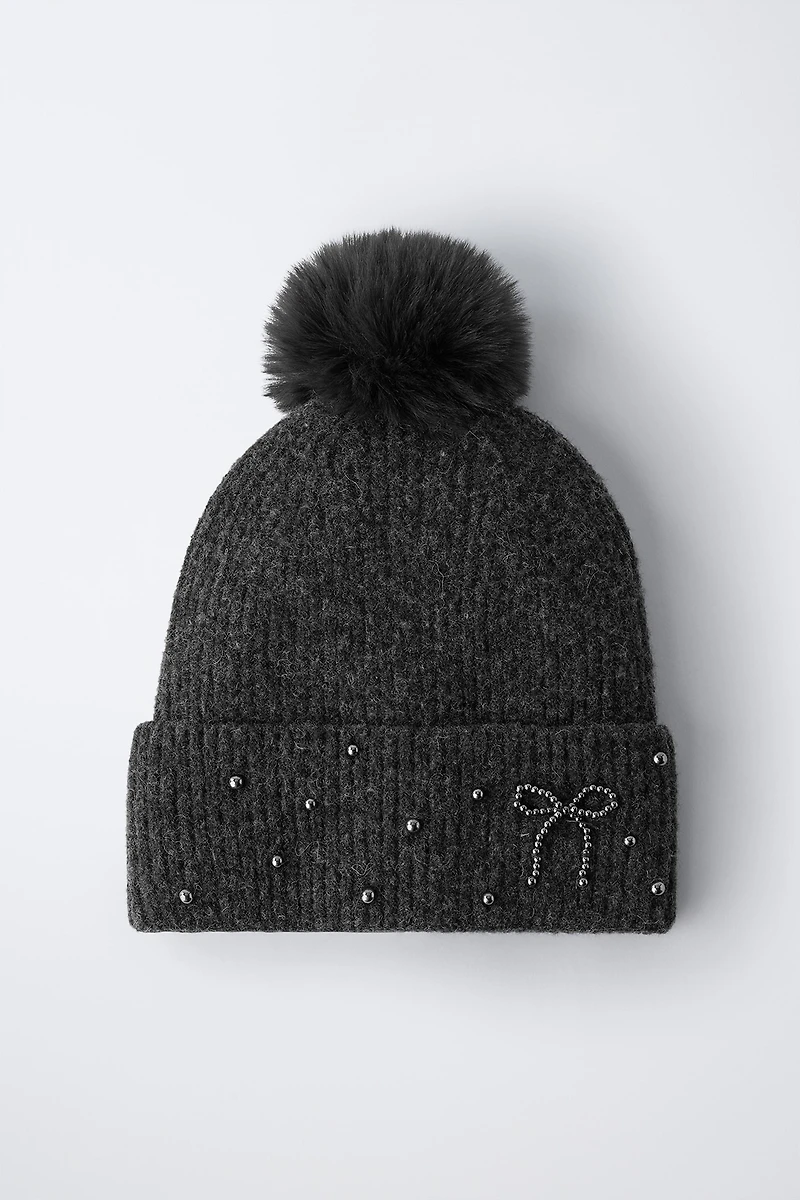 BONNET EN MAILLE BRILLANT À POMPON AVEC LAINE