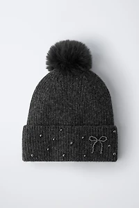 BONNET EN MAILLE BRILLANT À POMPON AVEC LAINE