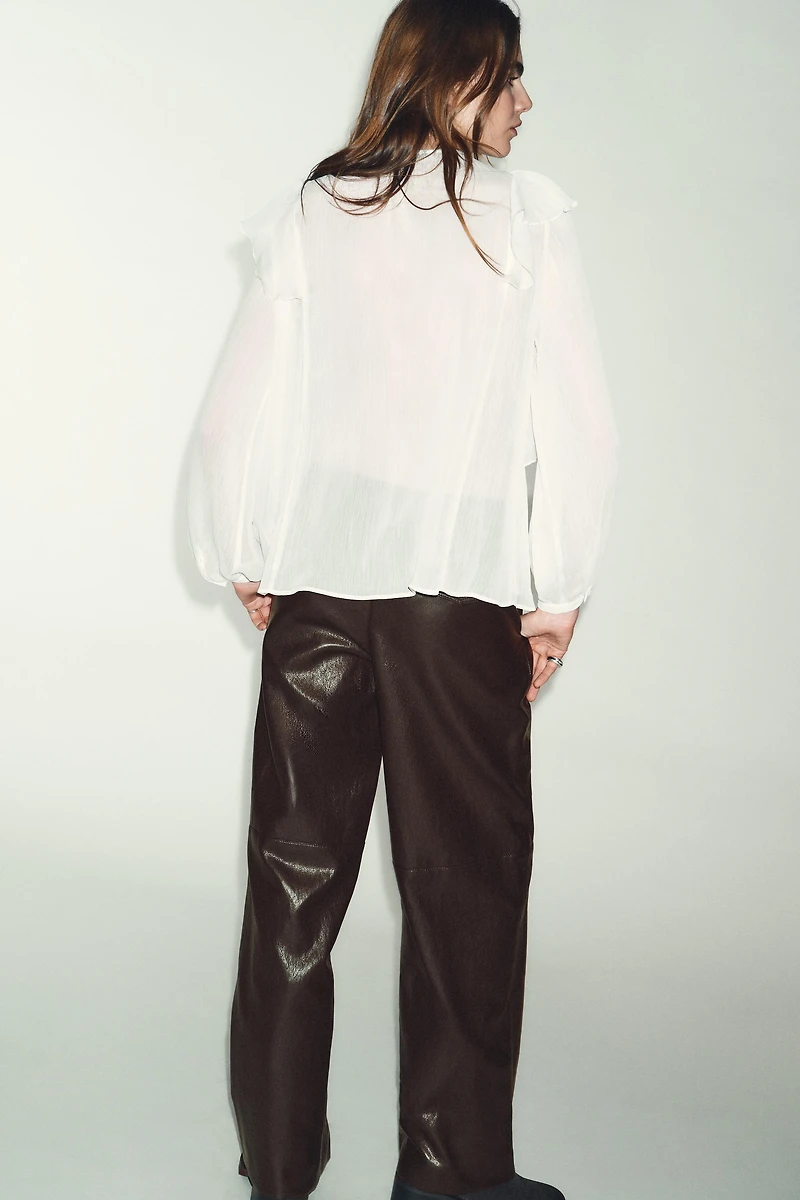BLOUSE À PLIS ET VOLANTS