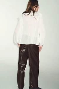 BLOUSE À PLIS ET VOLANTS