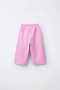 WIDE LEG INTERLOCK RAISED TEXT PANTS