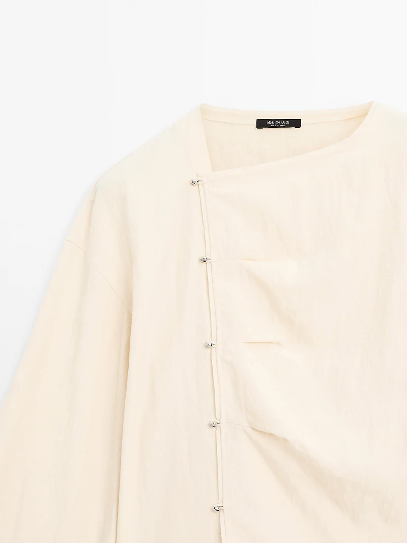 Long sleeve blouse with side button fastening