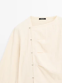 Long sleeve blouse with side button fastening