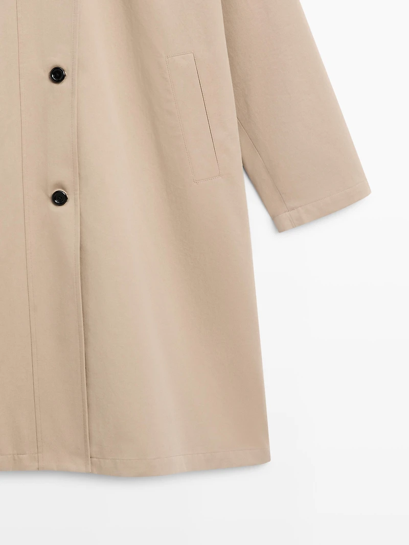 Long 100% cotton trench coat with side fastening