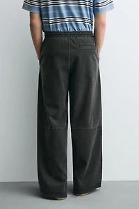 PANTALON RELAXED FIT CLOUS MATIÈRE SYNTHÉTIQUE