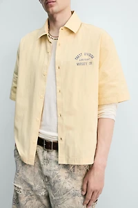 PRINTED TEXT BOXY FIT SHIRT