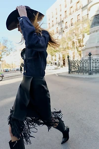 JUPE MI-LONGUE À FRANGES MATIÈRE SYNTHÉTIQUE