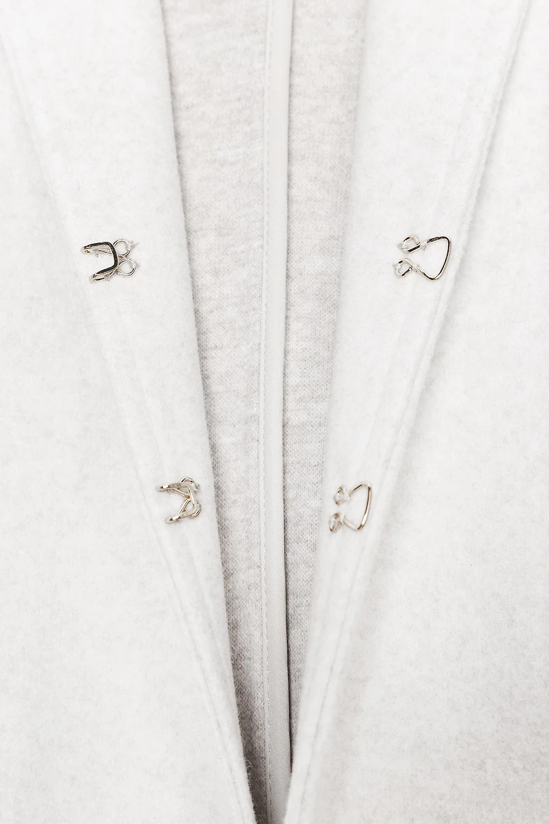 ROUND NECK BELTED BLAZER