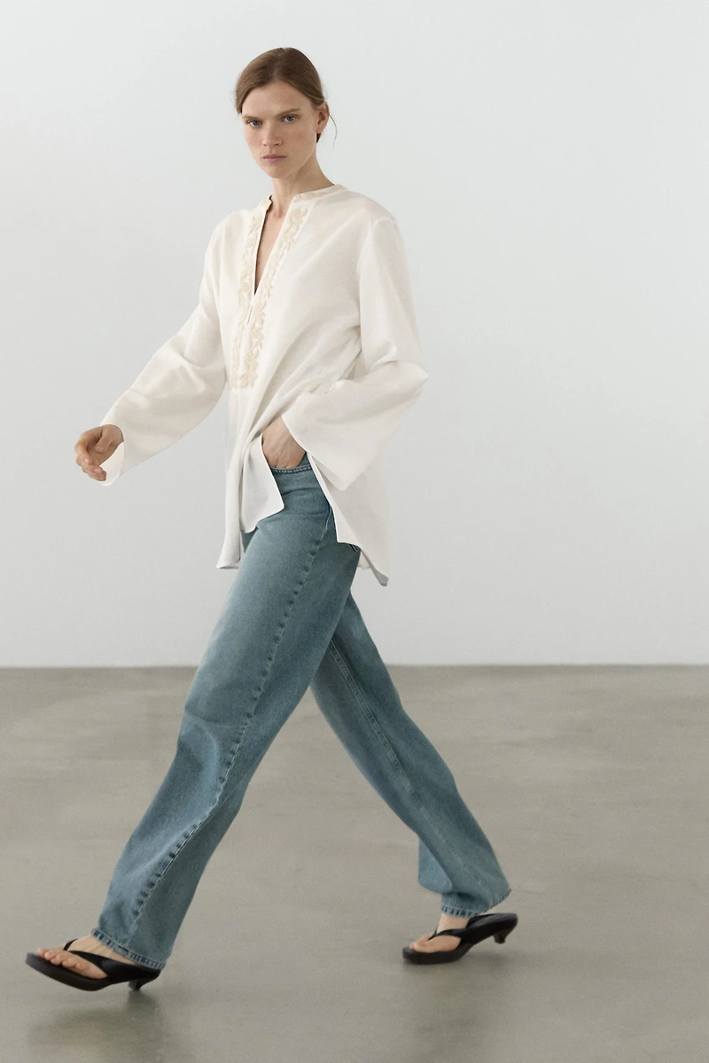 Flowing oversize blouse with stand collar and embroidery