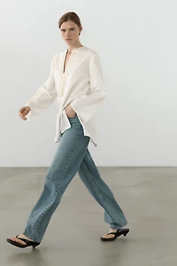 Flowing oversize blouse with stand collar and embroidery