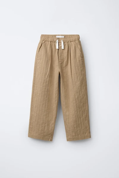 STRAIGHT TEXTURED PLEATED PANTS