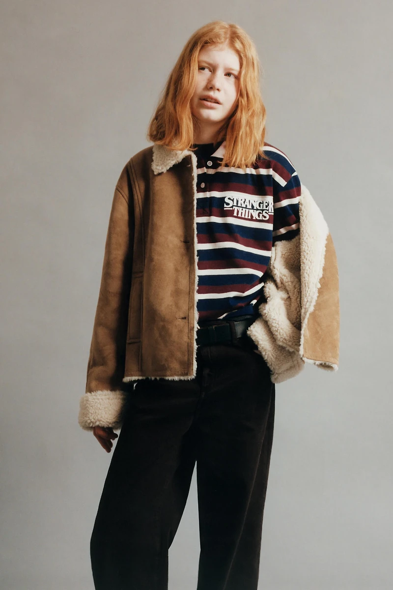 STRIPED STRANGER THINGS © NETFLIX POLO SHIRT