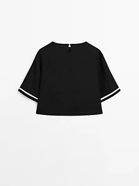 Blouse with contrast embroidery