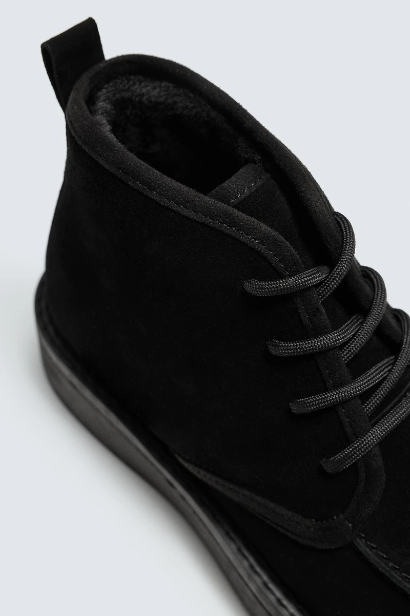 BOTTES EN CUIR À LACETS