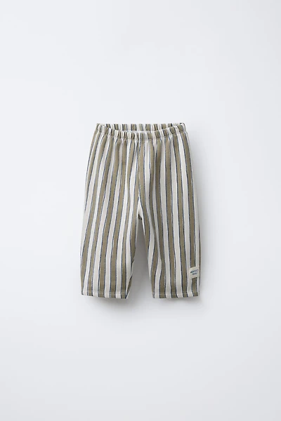 PANTALON BAGGY À RAYURES ET DÉCOR ÉTIQUETTE