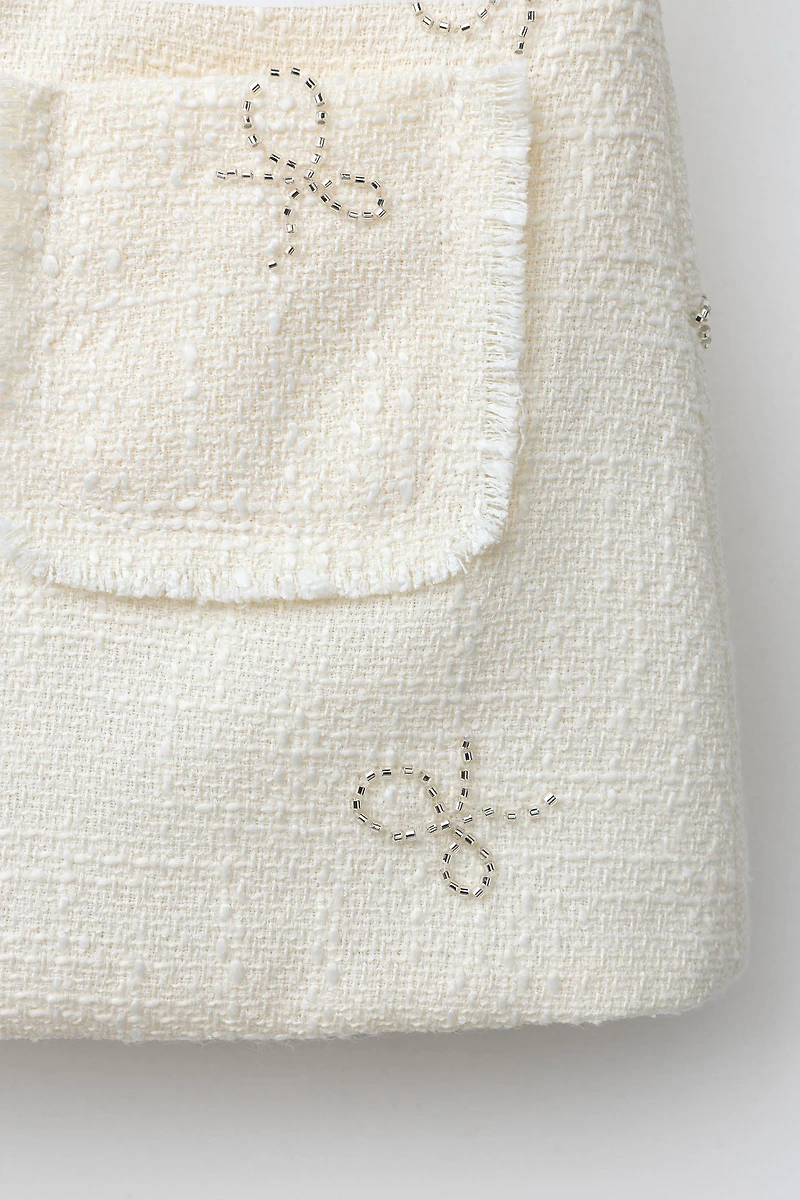 SHINY BOW TEXTURED SKIRT