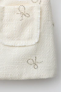 SHINY BOW TEXTURED SKIRT