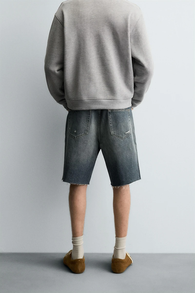 BERMUDA EN DENIM DÉCHIRÉ