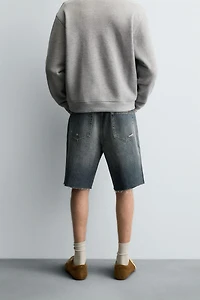 BERMUDA EN DENIM DÉCHIRÉ