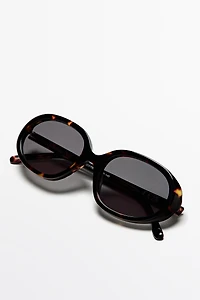 Oval tortoiseshell-effect sunglasses