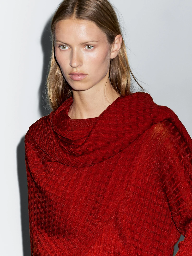 Cable-knit sweater with scarf detail